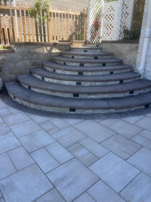Curved stone and paver steps built by ARM Construction Group