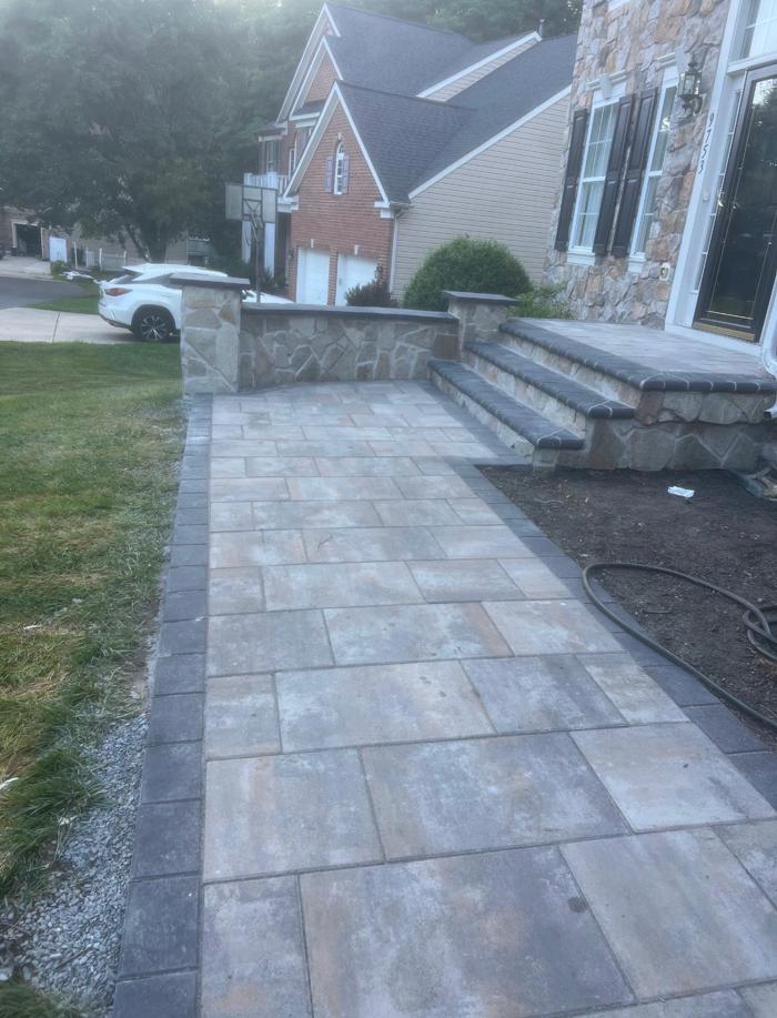 New paver walkway with stone seat wall and steps